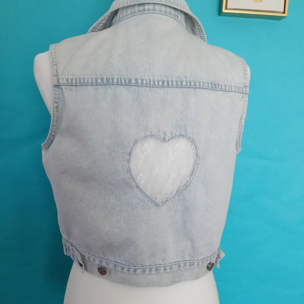 Vest L A . Blue  with a lace heart in the back  size  Large girls color light